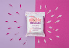 One pack of Jackson Reece Kinder by Nature 100% Biodegradable Nose Nuzzle Wipes surrounded by pink flower petals